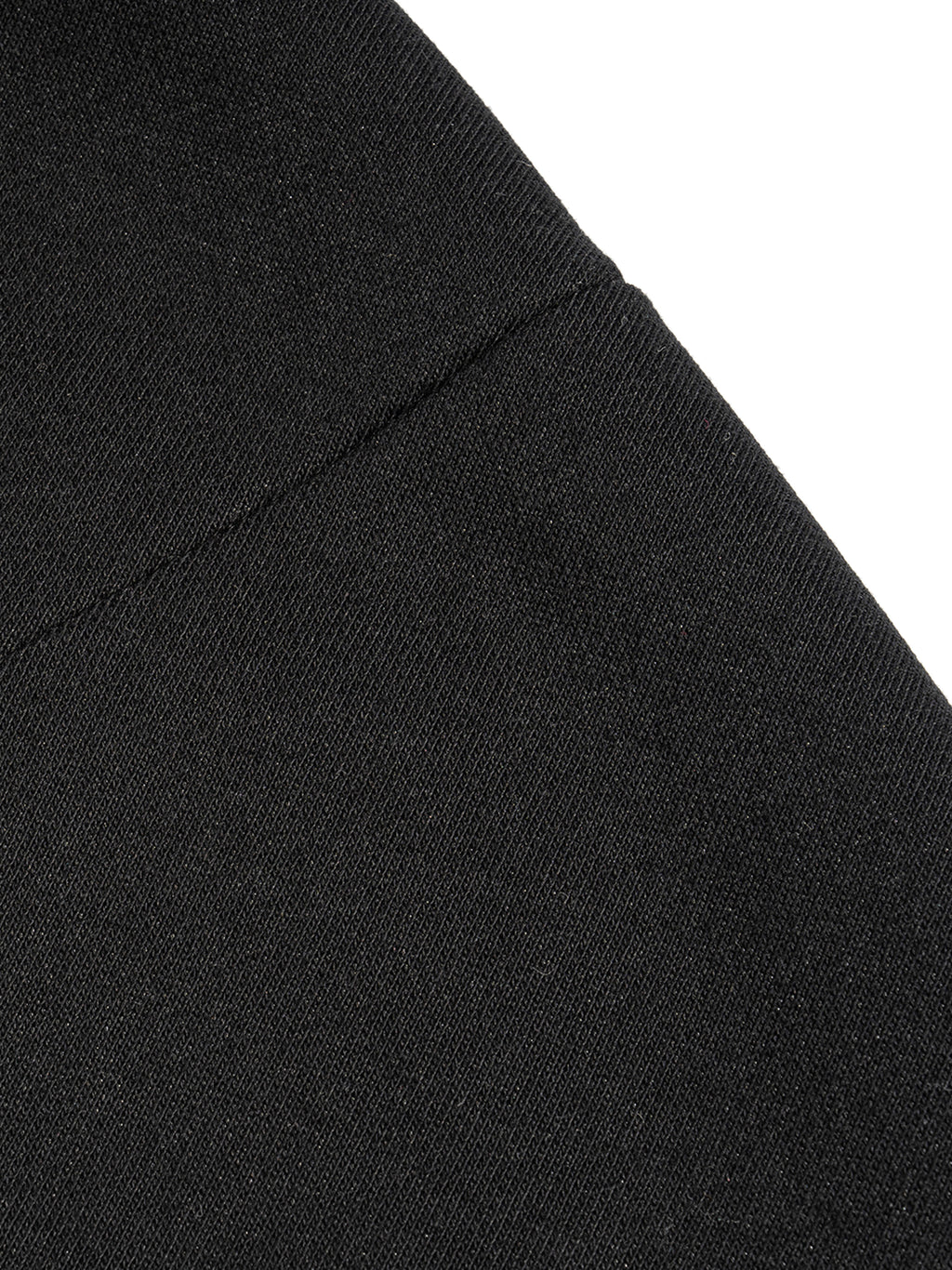 Close-up of black fabric texture on a french terry boxy tank top by FETISHISTO showing stitching detail