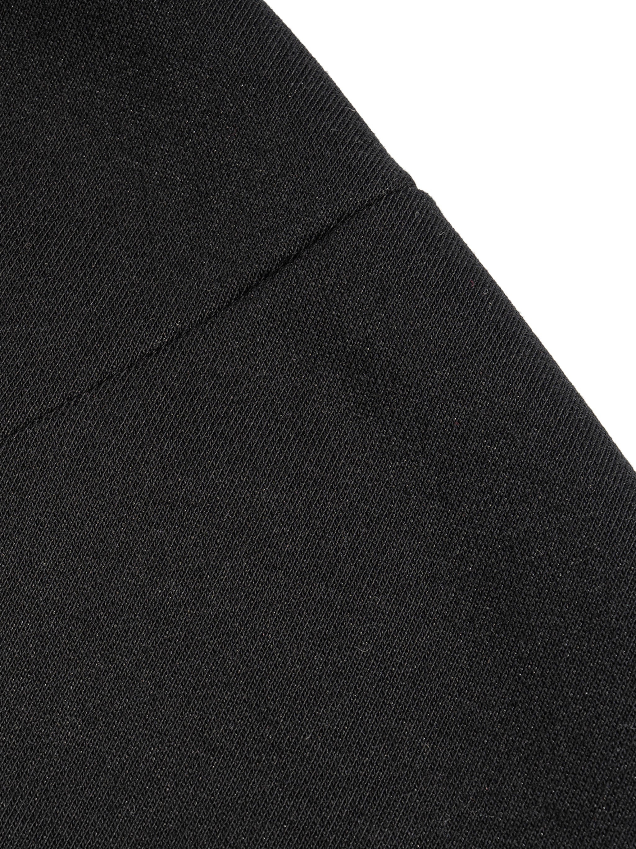 Close-up of black fabric texture on a french terry boxy tank top by FETISHISTO showing stitching detail