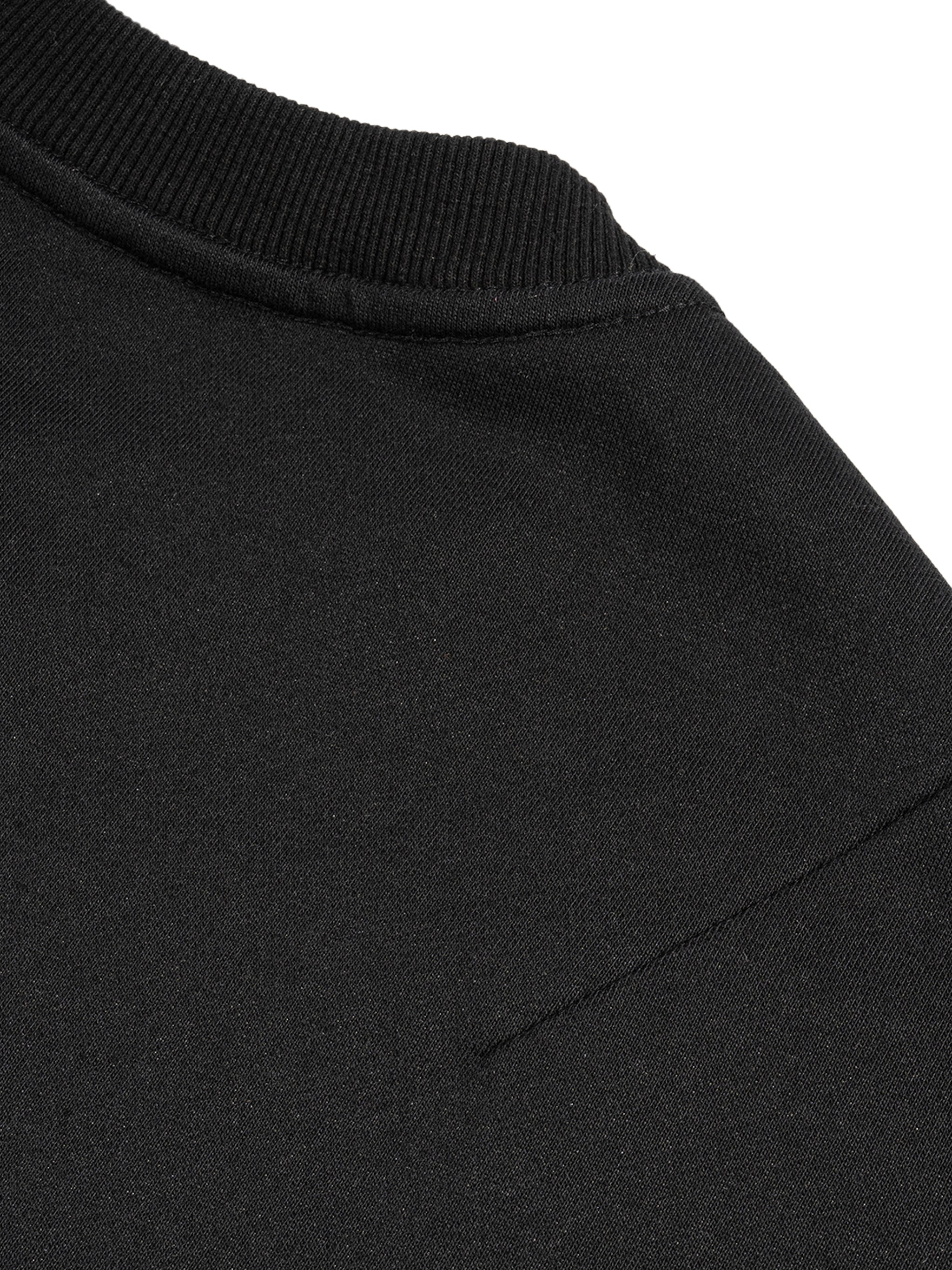 Close-up of black fabric and stitching detail on french terry boxy tank top by FETISHISTO