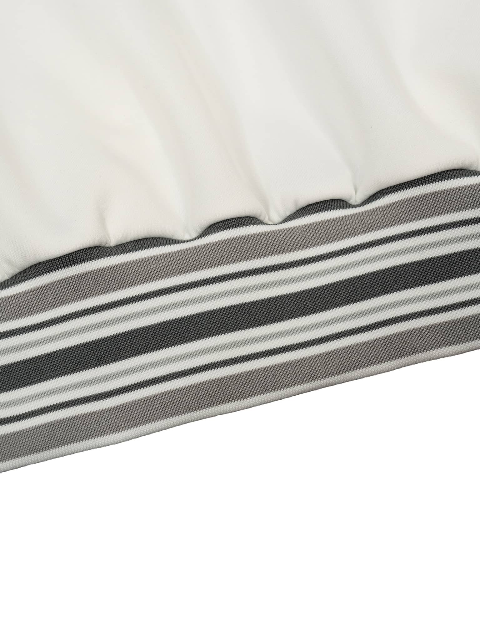 Close-up of striped rib collar zip jacket hem in gray white and black by FETISHISTO