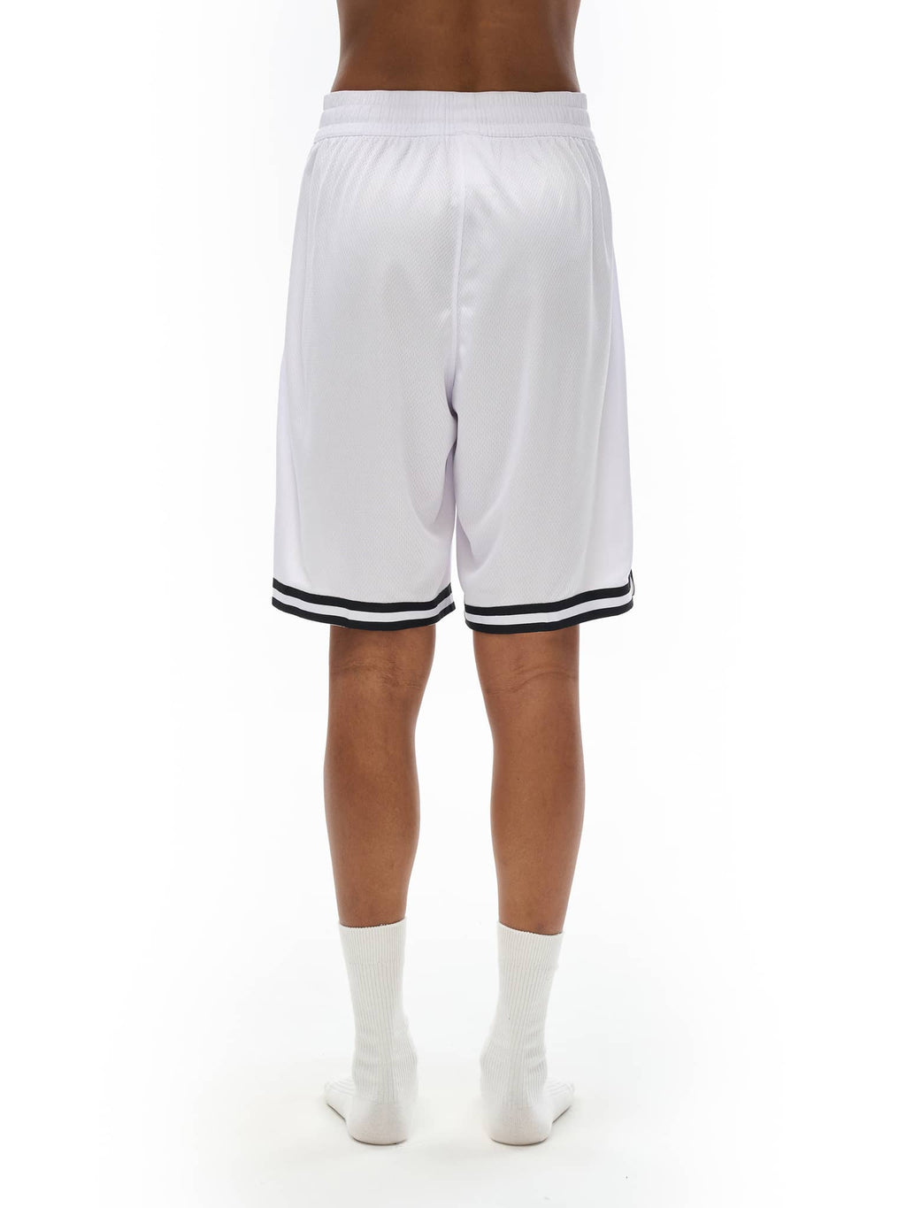 Back view of white classic basketball shorts with black stripes on hem by FETISHISTO