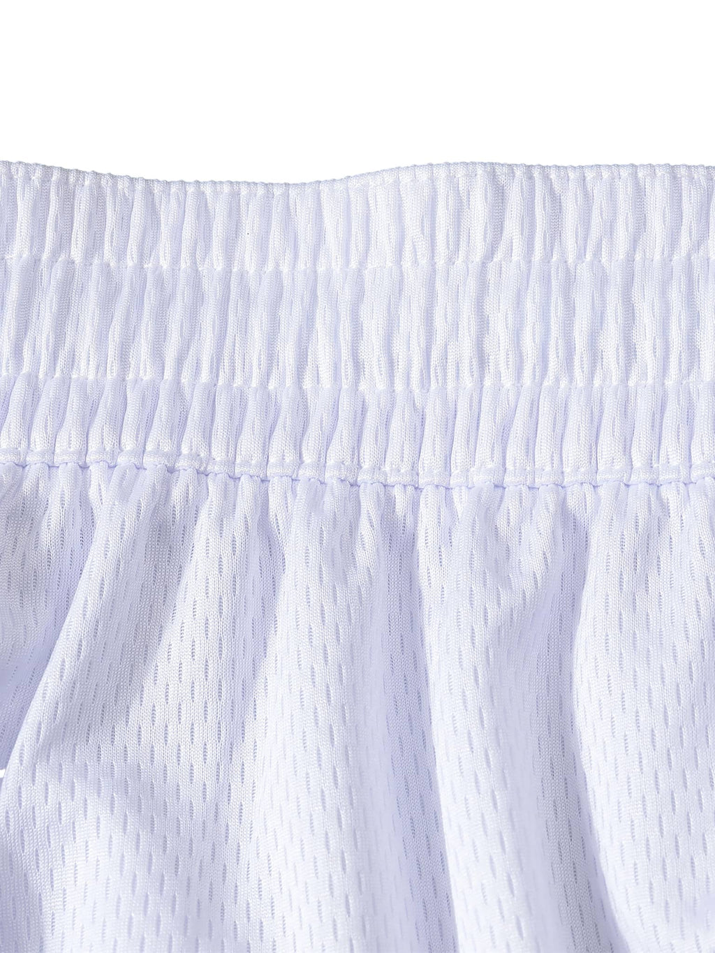 Close-up of white classic basketball shorts waistband and mesh fabric detail