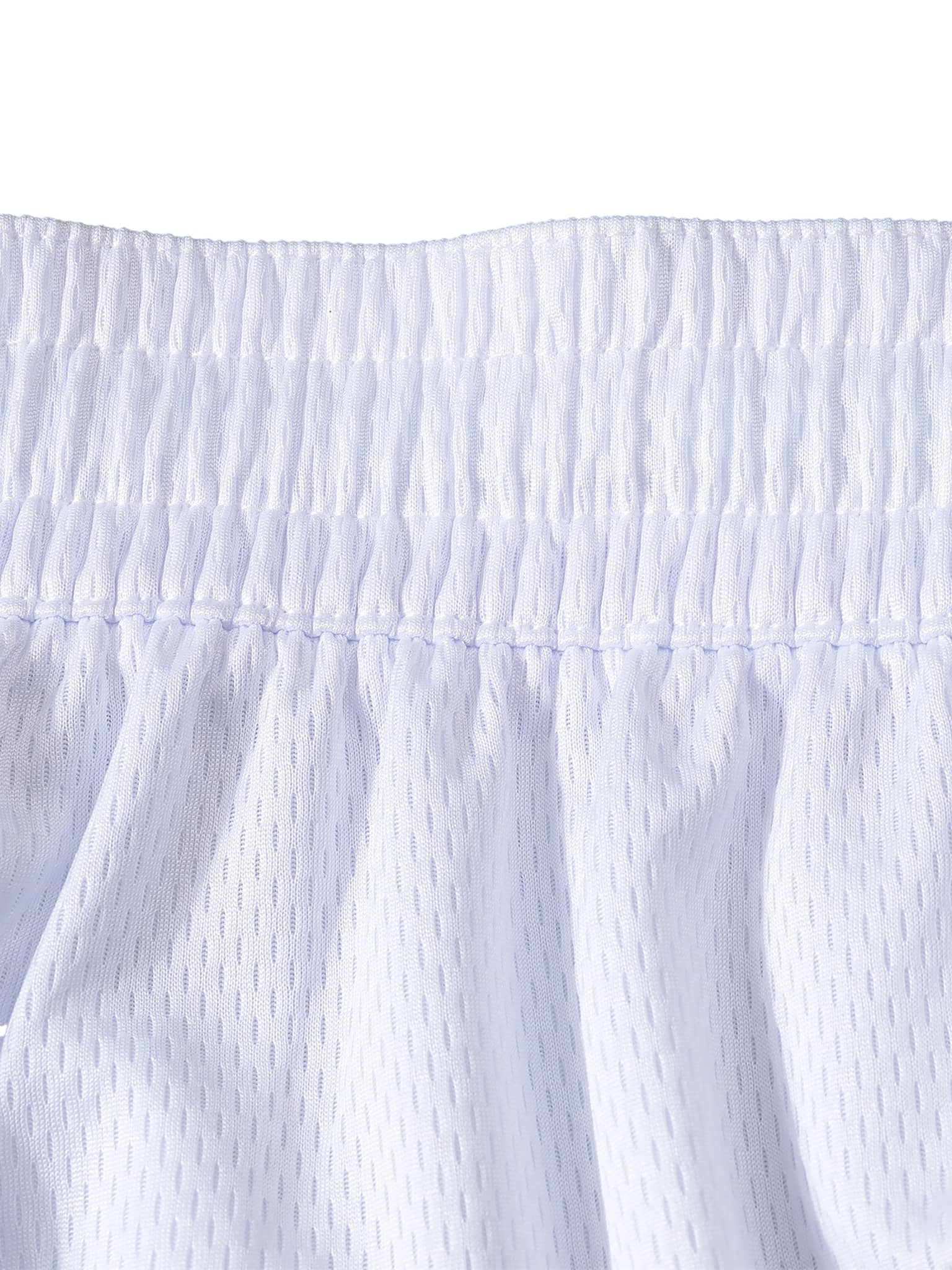 Close-up of white classic basketball shorts waistband and mesh fabric detail