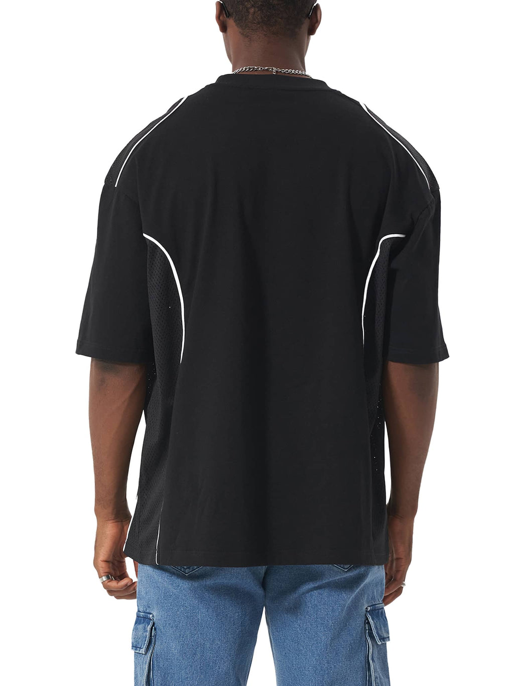 Back view of black contrast piped fetish t-shirt with white piping detail worn by male model