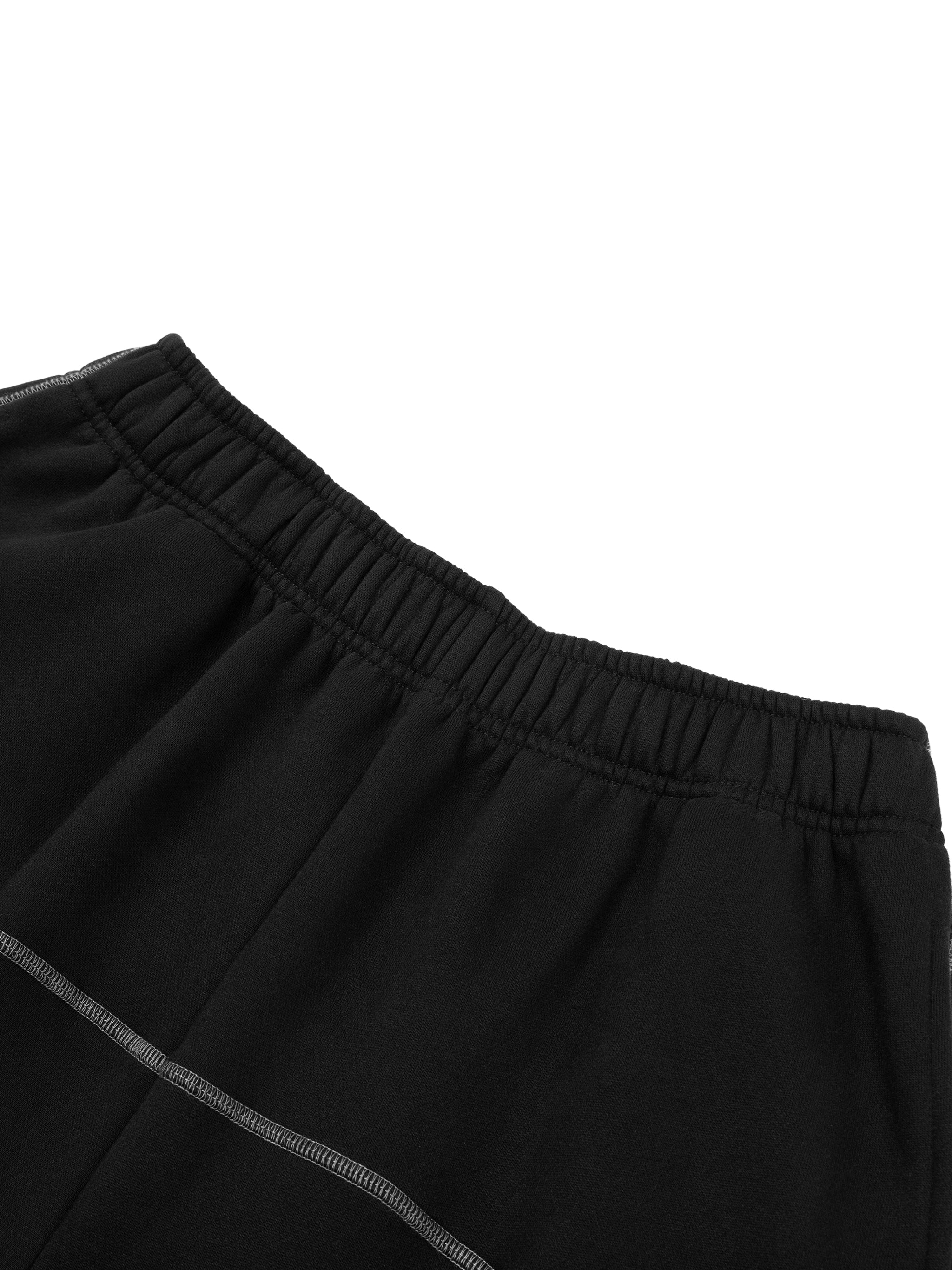 Close-up of black contrast stitch fleece sweatpants waistband and stitching details by FETISHISTO