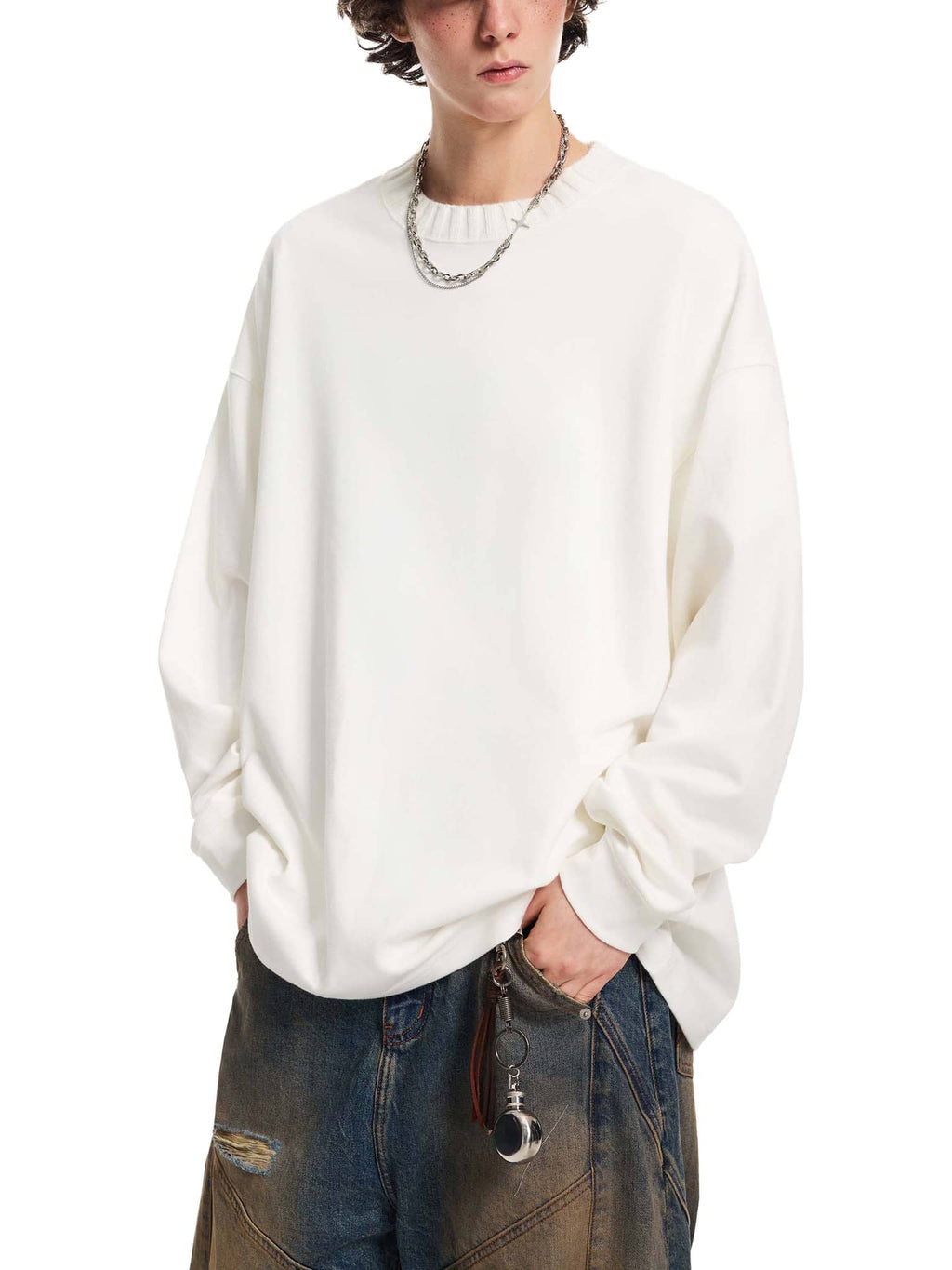 FETISHISTO oversize knitted round neck sweatshirt in white worn with baggy jeans