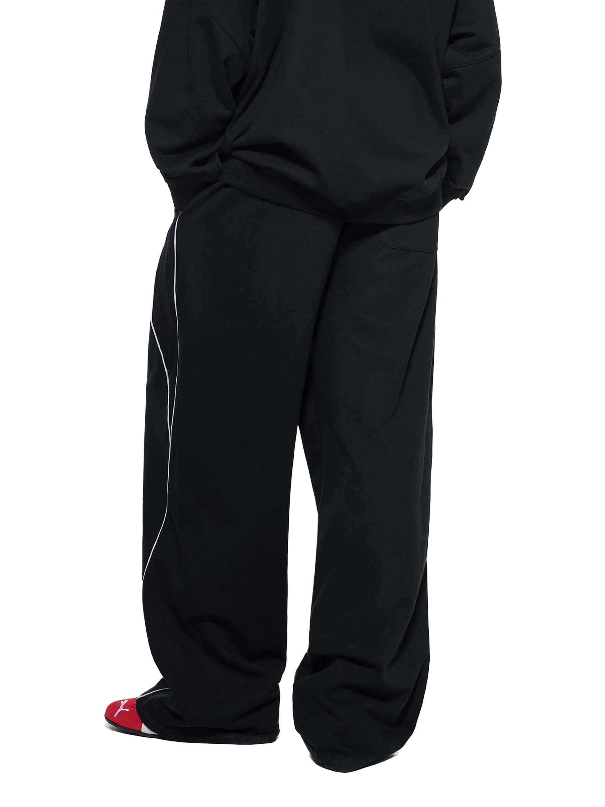 Black reflection striped sweatpants with wide legs and side reflective stripe by FETISHISTO