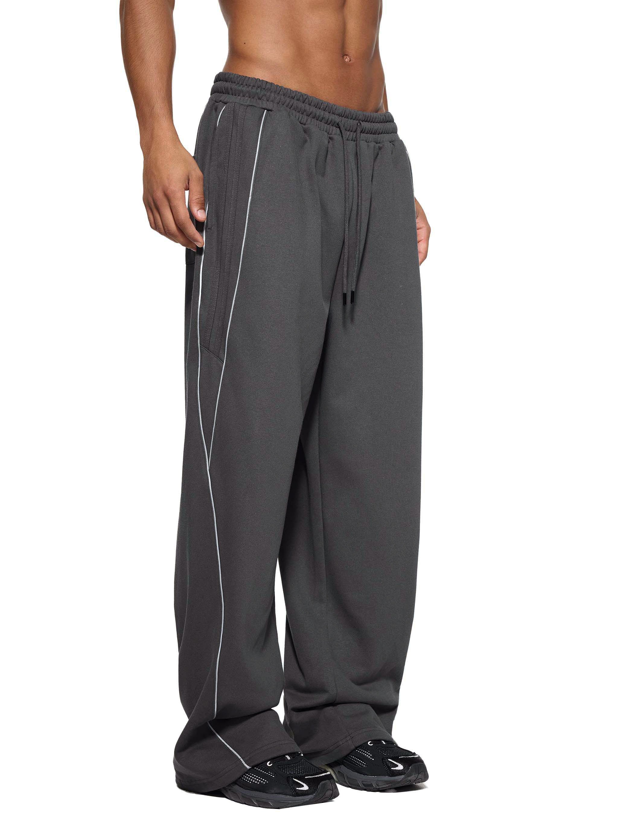 FETISHISTO reflection striped sweatpants in dark gray with white side stripes and drawstring waist