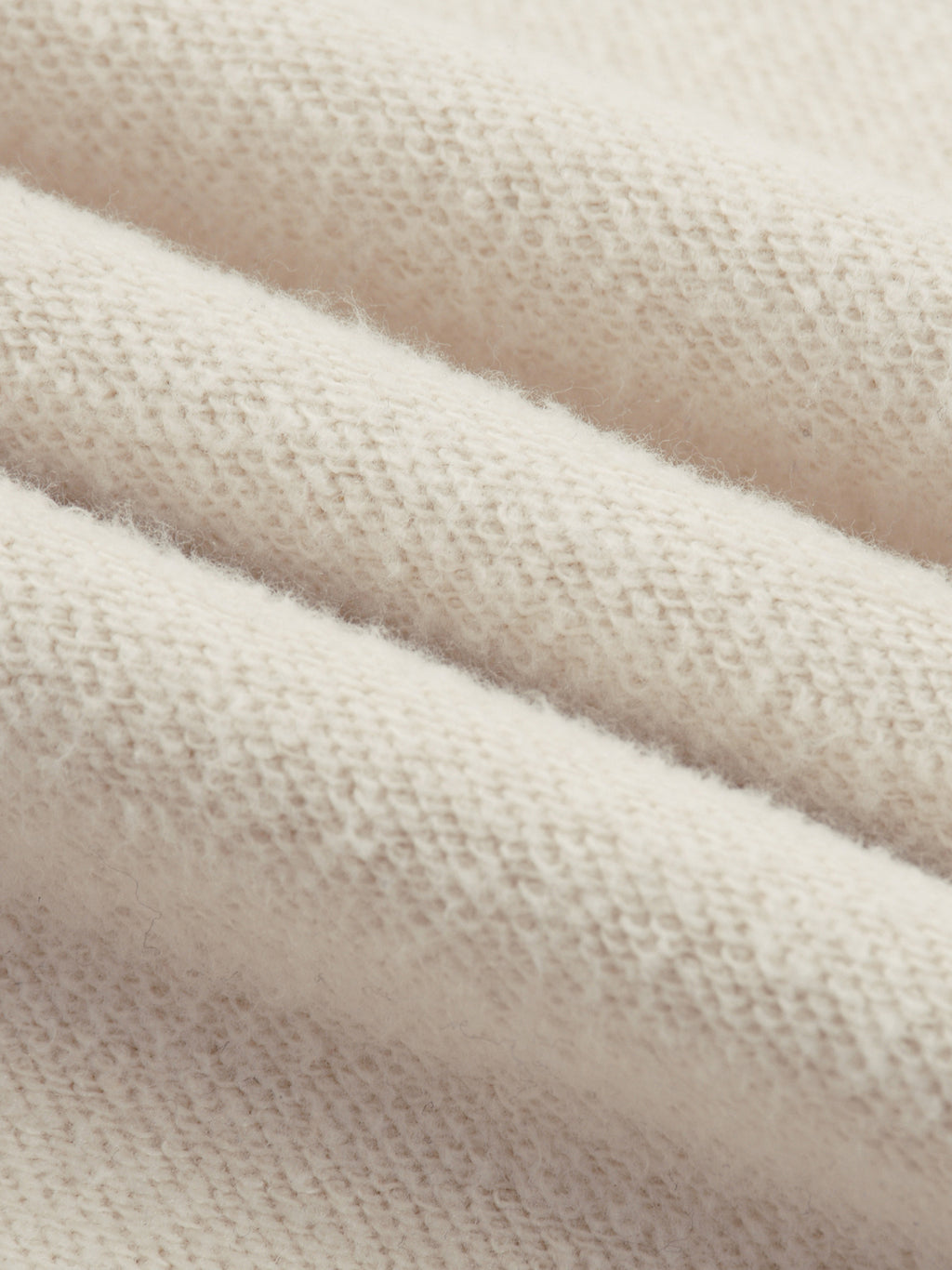 Close-up texture of soft fabric for reflection striped sweatpants by FETISHISTO in light beige color