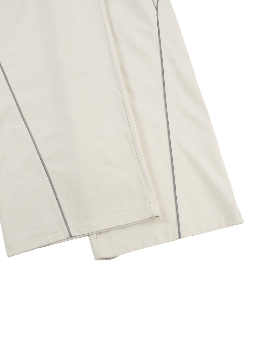 Close-up of beige reflection striped sweatpants with thin dark stripes from FETISHISTO