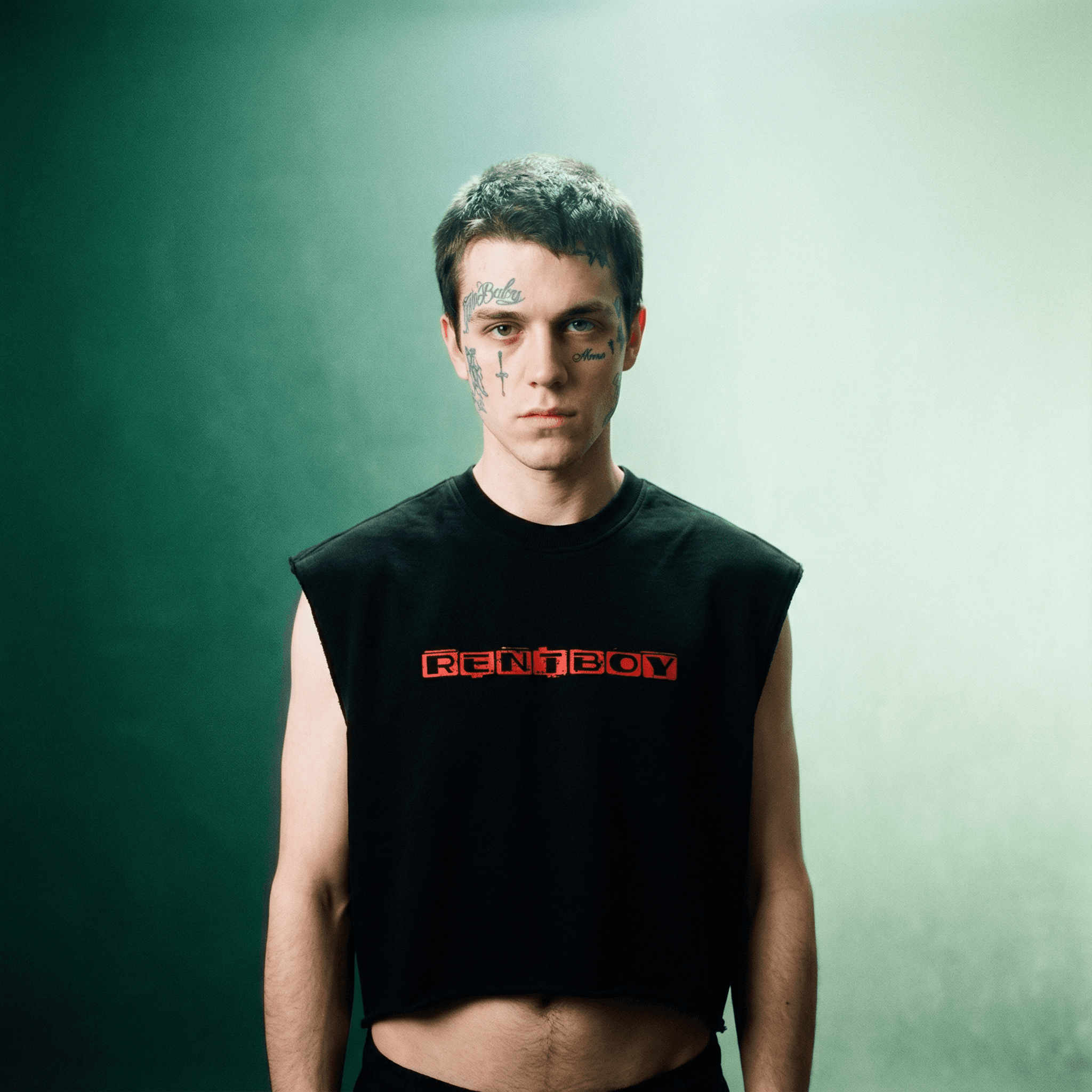 Black french terry boxy tank top with red print worn by male model with tattoos