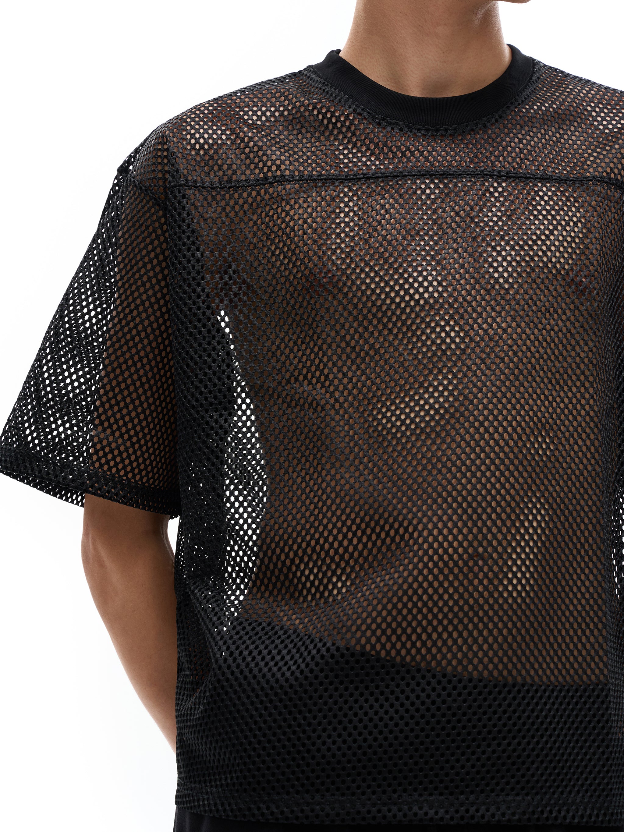 ODMPOD black see-through mesh t-shirt with short sleeves and crew neck on male model