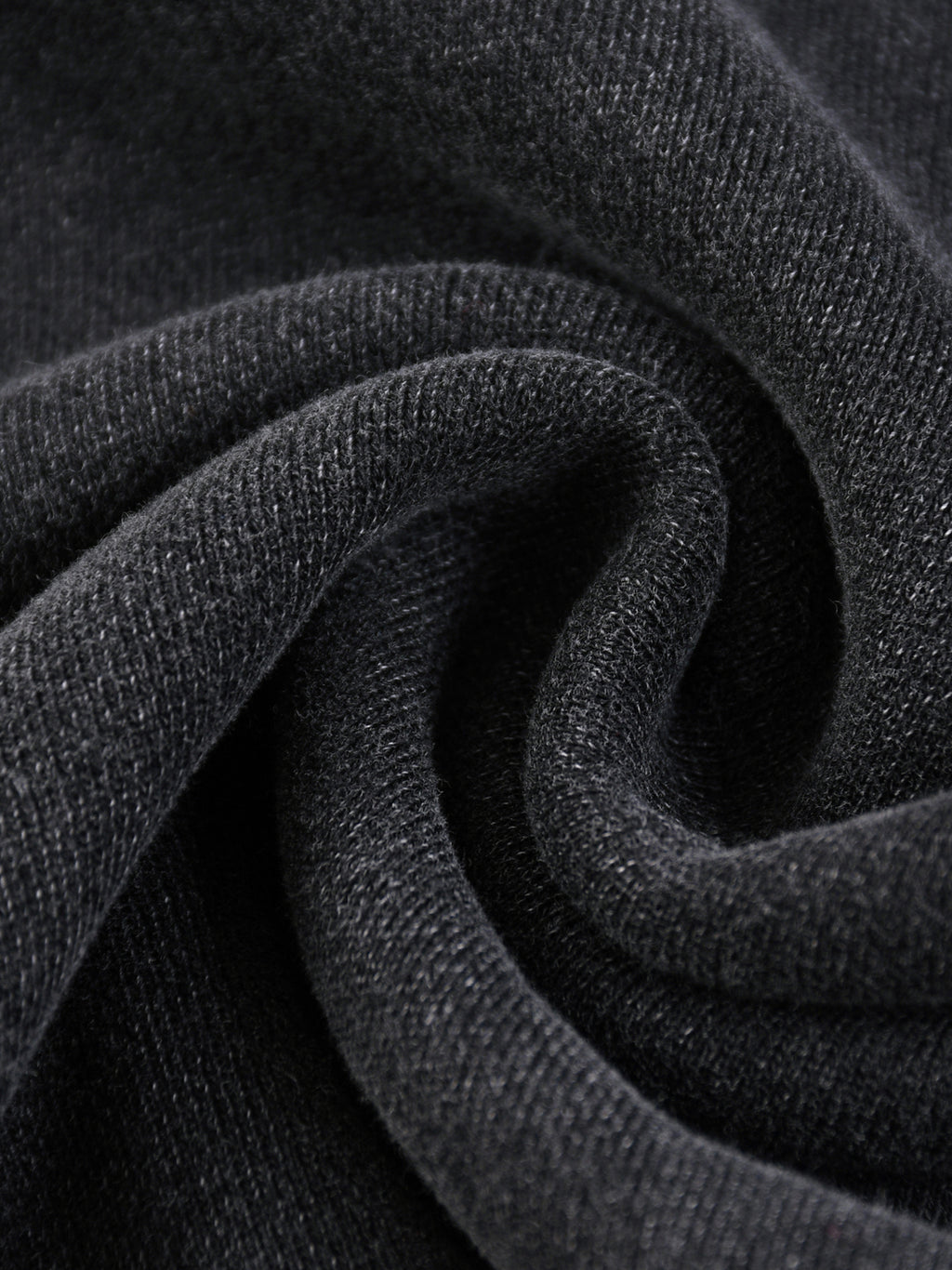 Close-up texture of black fabric from snow washed sweatpants for men by FETISHISTO