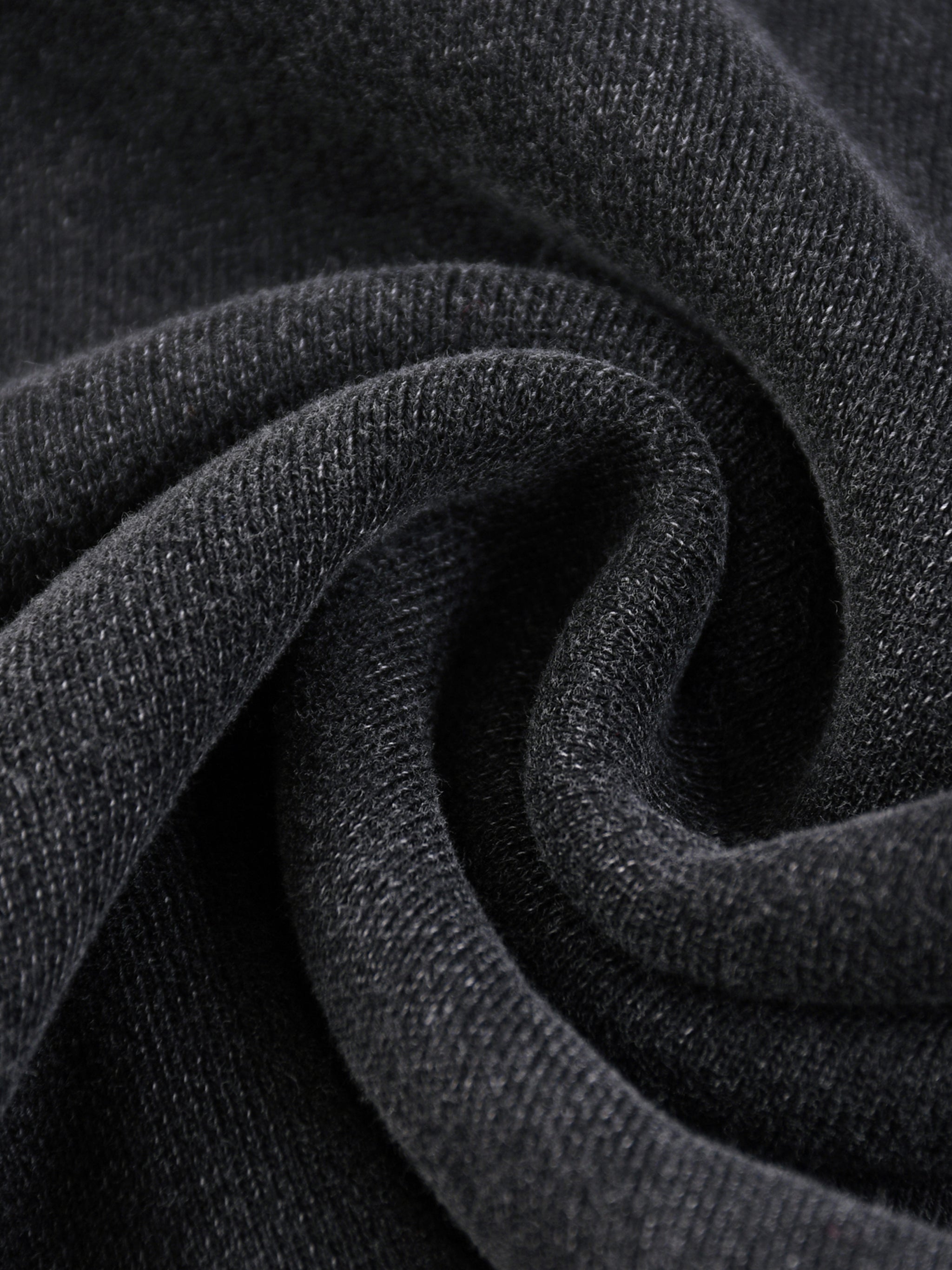Close-up texture of black fabric from snow washed sweatpants for men by FETISHISTO