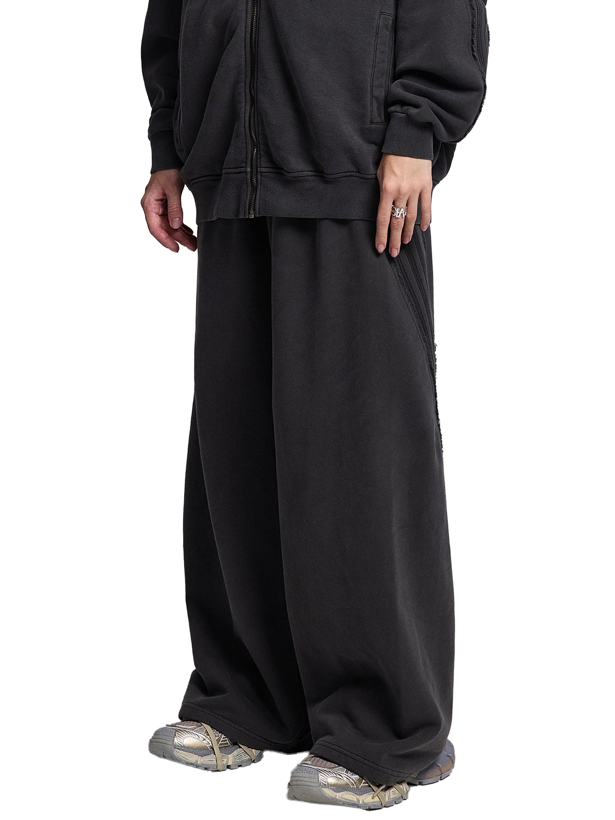 Black snow washed sweatpants for men with wide leg fit and casual style by FETISHISTO