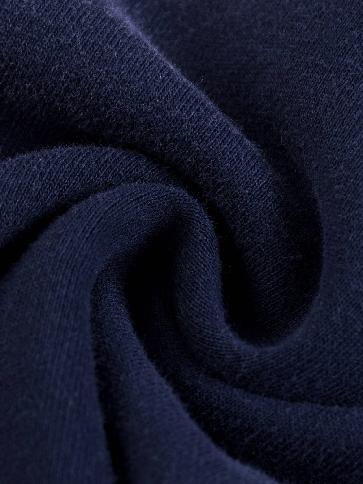Close-up texture of navy fabric material for sun fade straight leg sweatpants by FETISHISTO