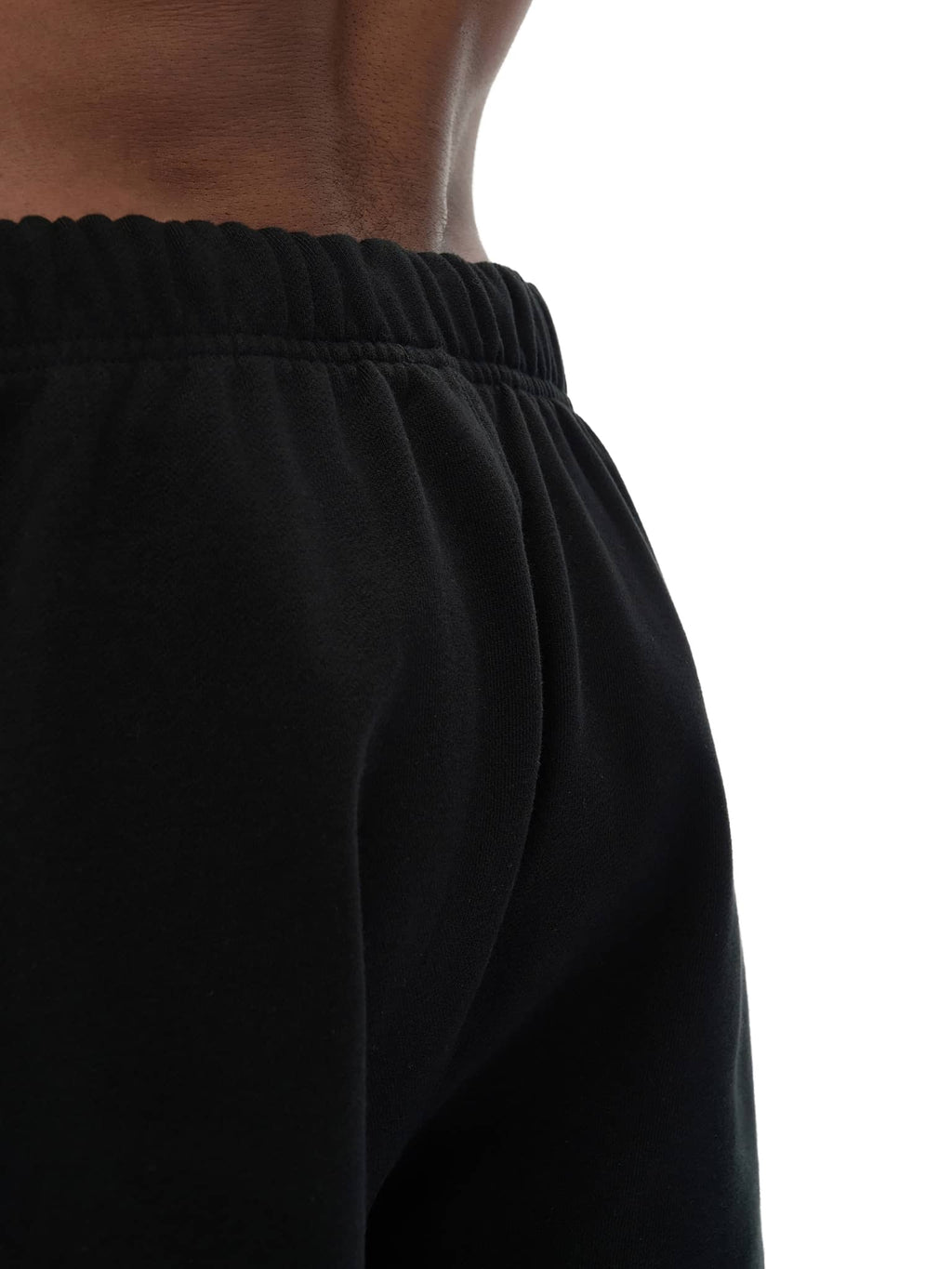 Close-up of black unisex heavyweight fleece shorts waistband and fabric texture by FETISHISTO