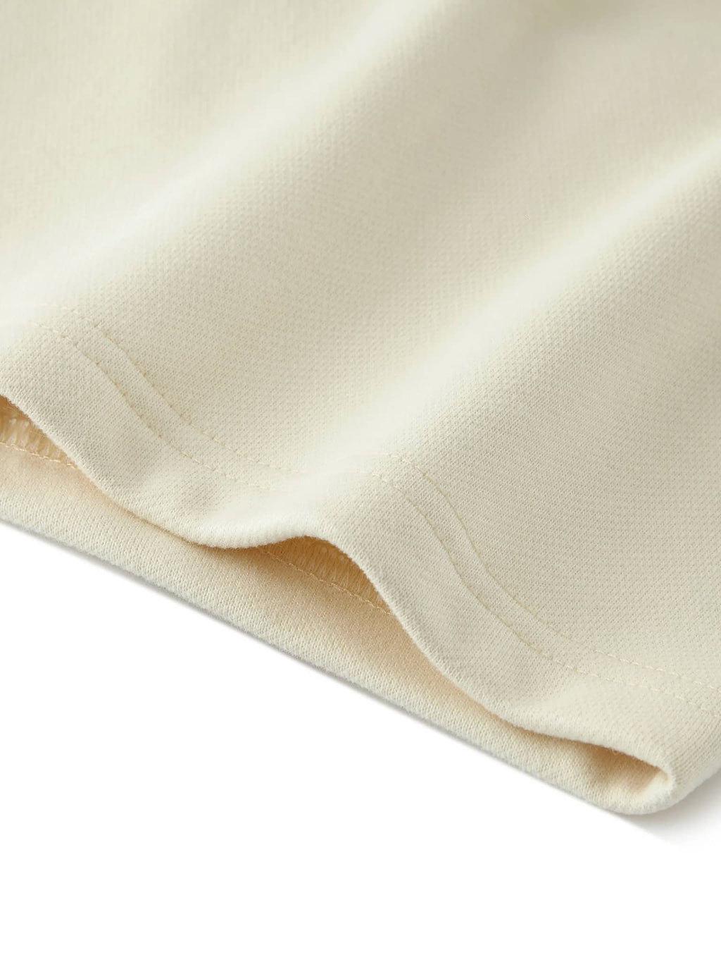 Close-up of cream fabric detail for unisex heavyweight fleece shorts by FETISHISTO
