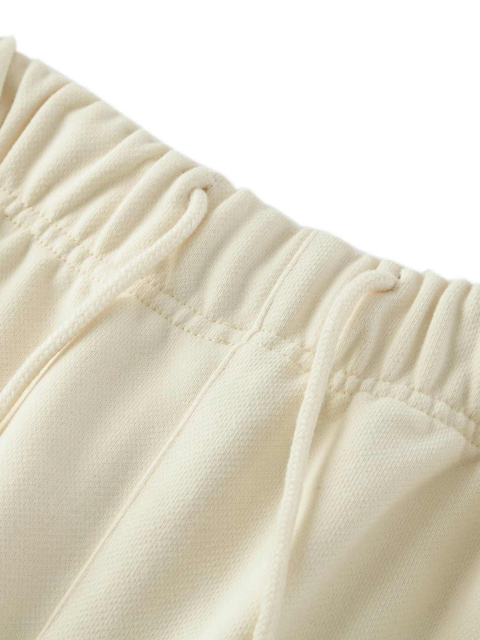 Close-up of cream colored unisex heavyweight fleece shorts waistband with drawstring by FETISHISTO