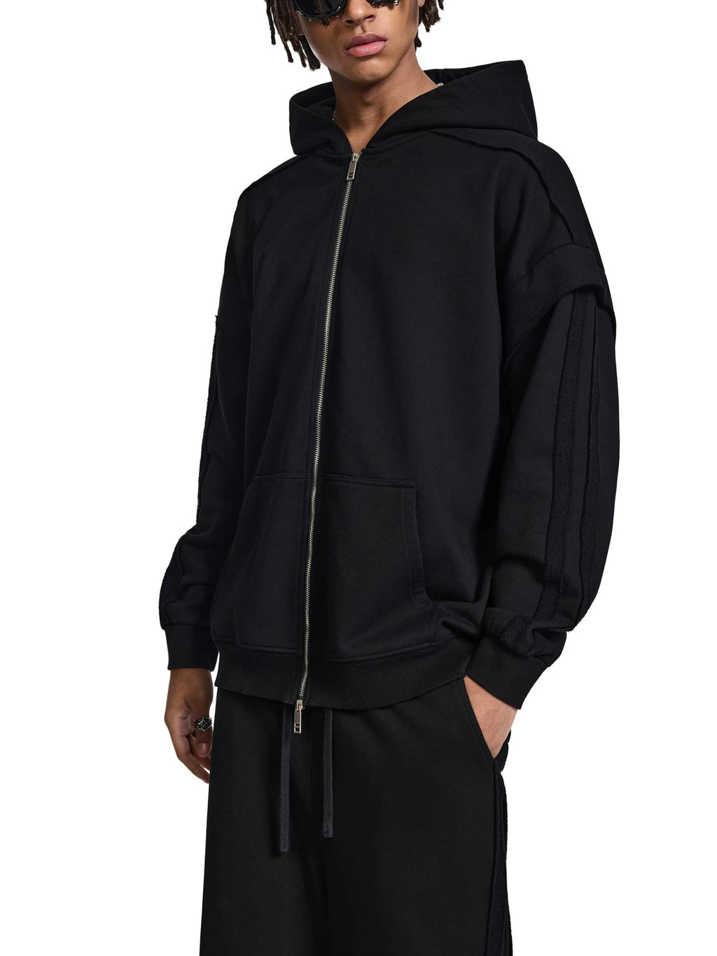 ODMPOD black fetish style zip hoodie with front pockets and hood worn by male model