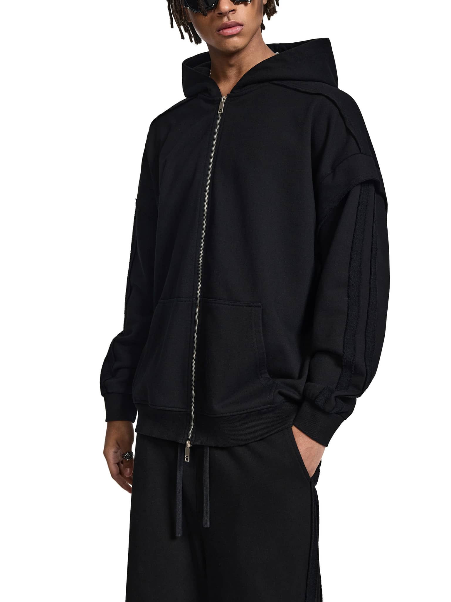 ODMPOD black fetish style zip hoodie with front pockets and hood worn by male model